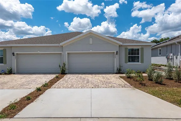 a front view of a house with yard
