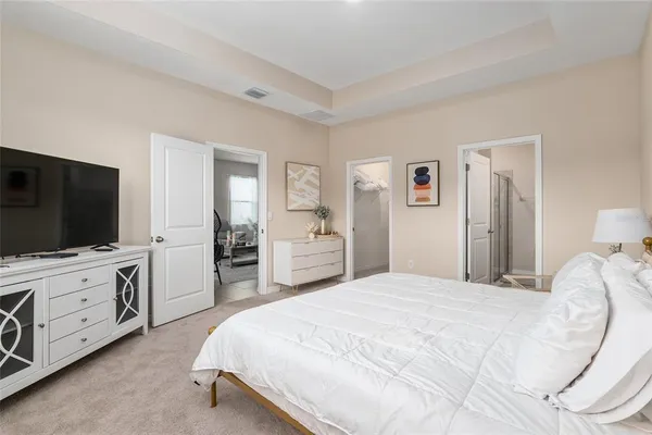 a bathroom with a granite countertop sink mirror vanity and toilet