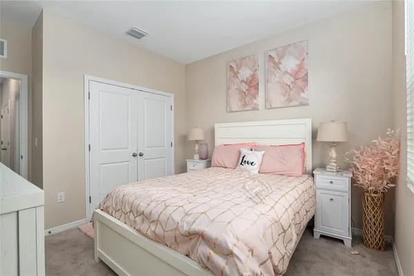 a bathroom with a granite countertop sink a toilet and a mirror