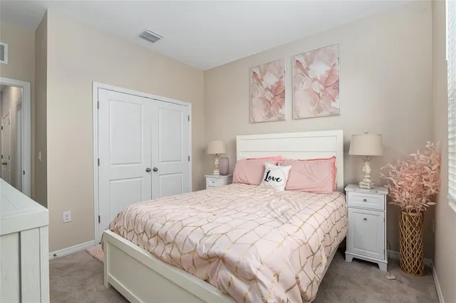 a bathroom with a granite countertop sink a toilet and a mirror