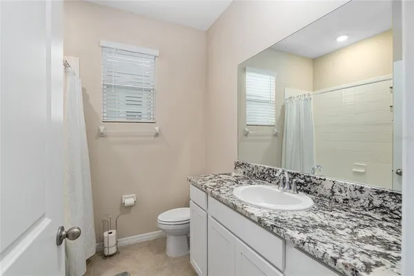 a bathroom with a shower and a bath tub