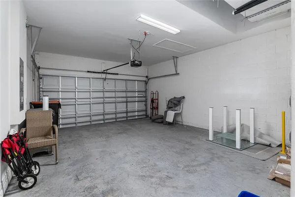 a view of a balcony with dining table and chairs