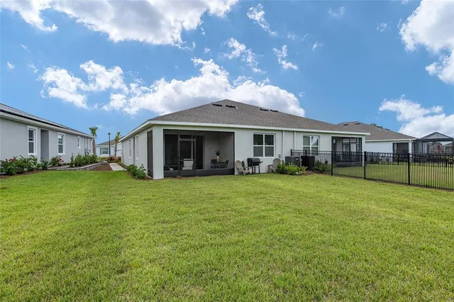 a view of a house with a yard porch and sitting area