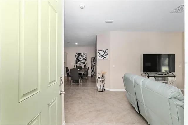 a view of a livingroom with furniture and a flat screen tv