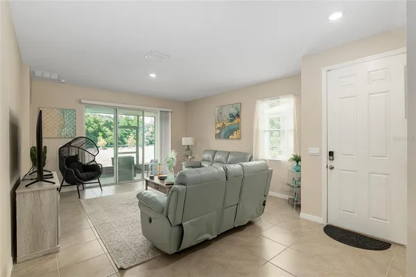 a living room with furniture and a large window