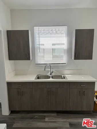 a kitchen with a sink and a window