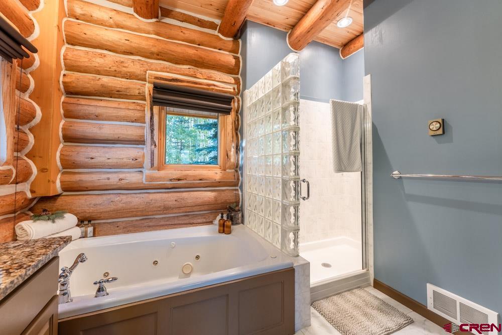 1851 Sioux Road Gunnison, CO 81230 - Photo 16 of 35 Master Bath with Jacuzzi Tub & Shower