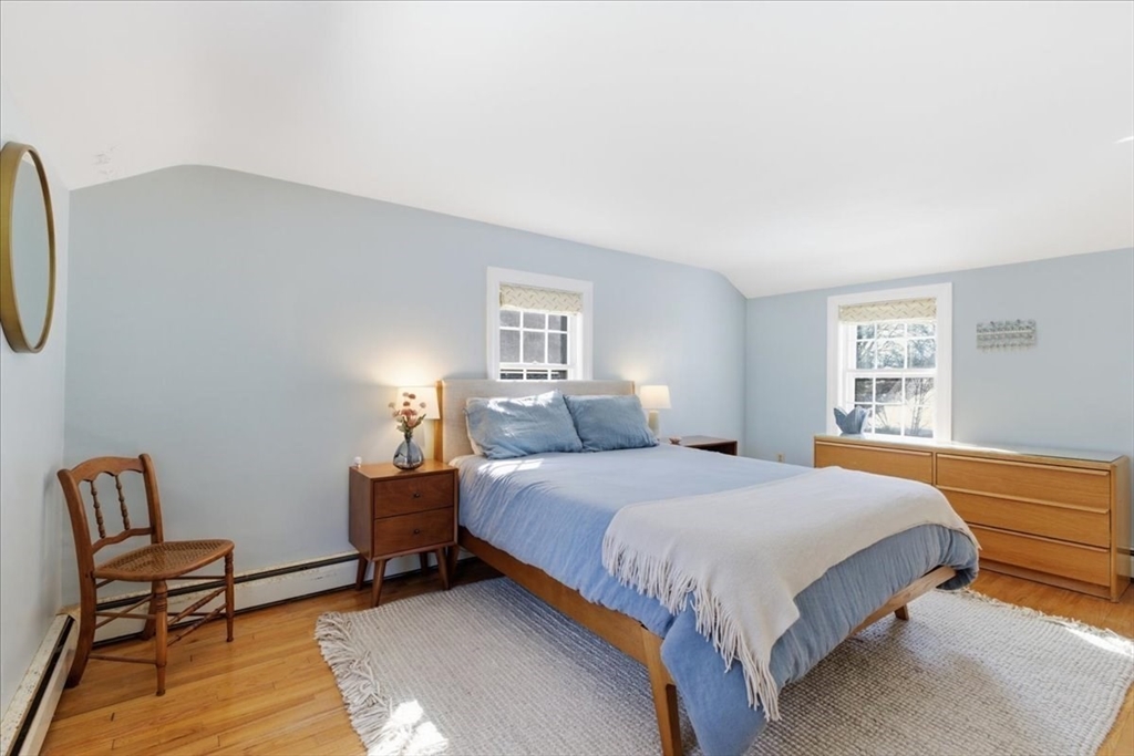 46 Park Street Dedham, MA 02026 - Photo 17 of 35 a bedroom with a bed chair and window