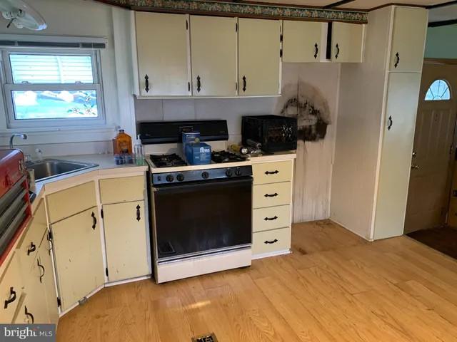 a kitchen with a stove and a refrigerator