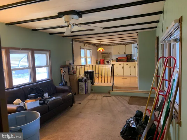 a living room with furniture and a window