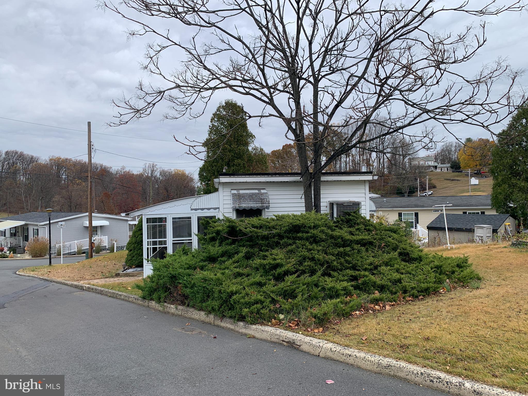 200 Anderson Avenue Media, PA 19063 - Photo 2 of 28 a front view of a house with garden and trees