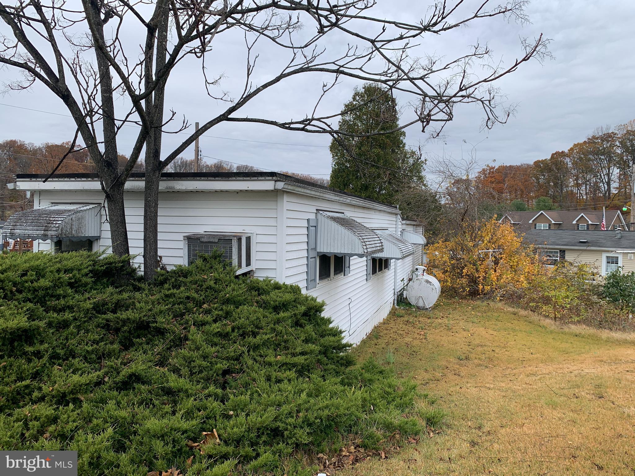 200 Anderson Avenue Media, PA 19063 - Photo 4 of 28 a view of a house with a large tree and a yard