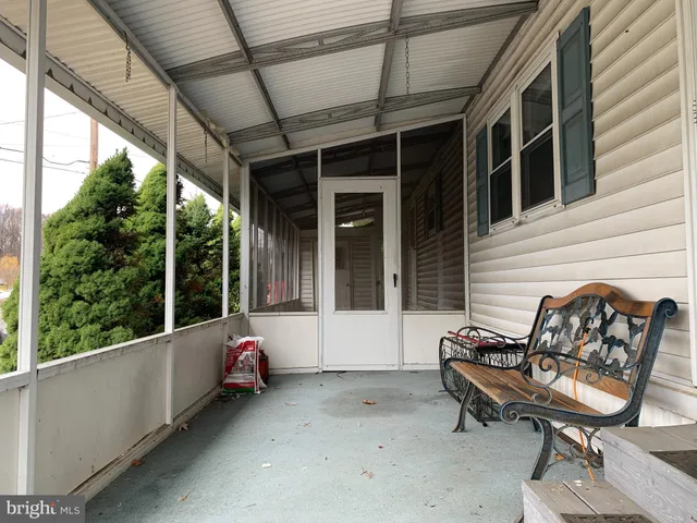 a balcony with furniture and a window