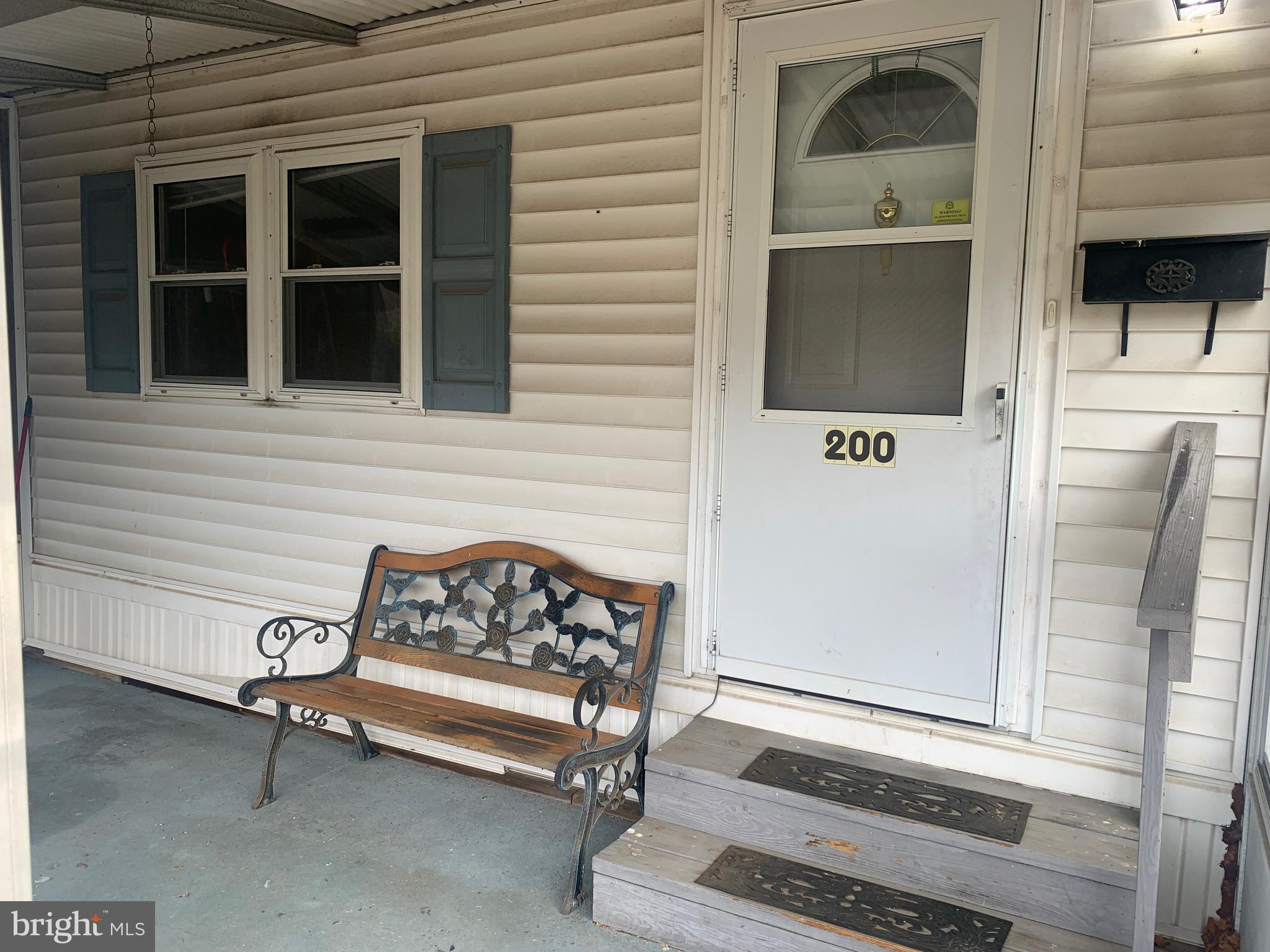 200 Anderson Avenue Media, PA 19063 - Photo 10 of 28 a house with a bench in front of house