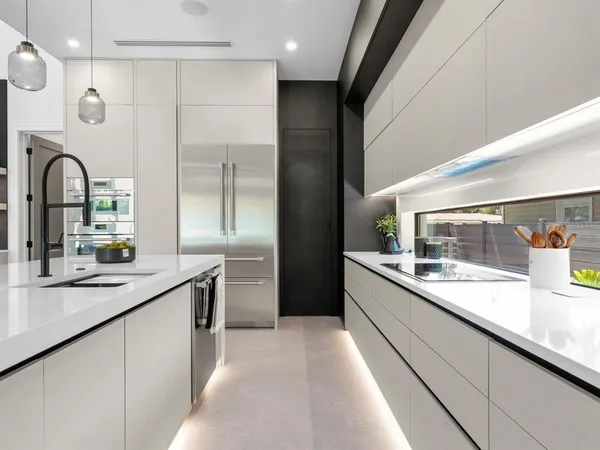 a kitchen with a sink and large window