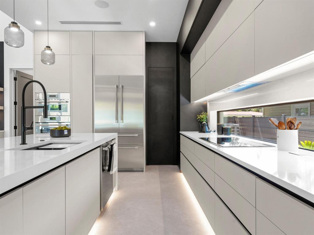 2467 Hyde Park Street Sarasota, FL 34239 - Photo 11 of 42 a kitchen with a sink and large window