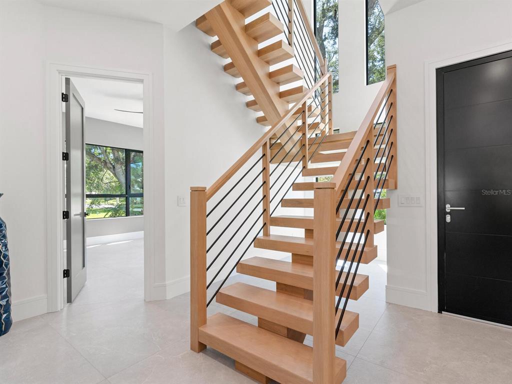 2467 Hyde Park Street Sarasota, FL 34239 - Photo 17 of 42 a view of entryway and hall with wooden floor