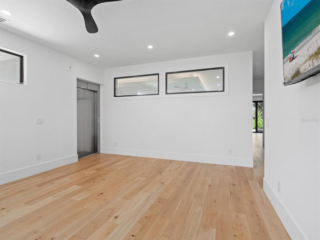 2467 Hyde Park Street Sarasota, FL 34239 - Photo 19 of 42 a view of empty room with wooden floor