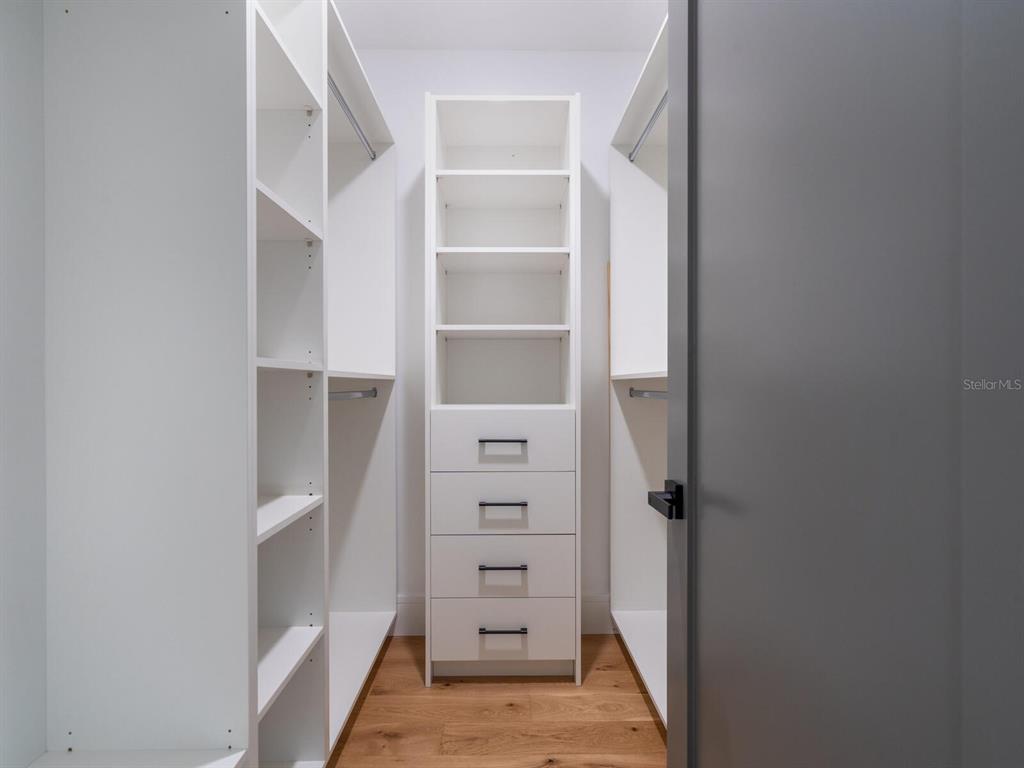 2467 Hyde Park Street Sarasota, FL 34239 - Photo 22 of 42 a view of walk in closet with empty racks