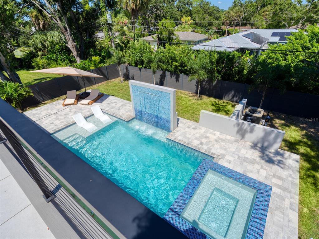 2467 Hyde Park Street Sarasota, FL 34239 - Photo 25 of 42 a view of a backyard with plants and a patio