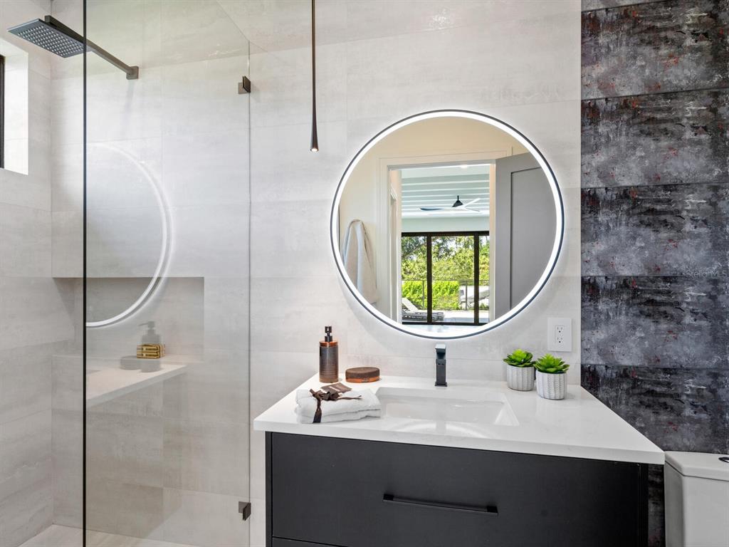 2467 Hyde Park Street Sarasota, FL 34239 - Photo 27 of 42 a bathroom with a sink and a mirror