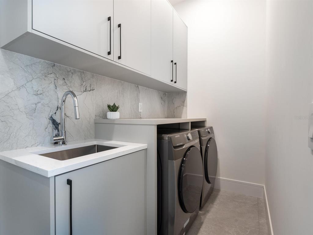 2467 Hyde Park Street Sarasota, FL 34239 - Photo 28 of 42 a utility room with dryer and washer