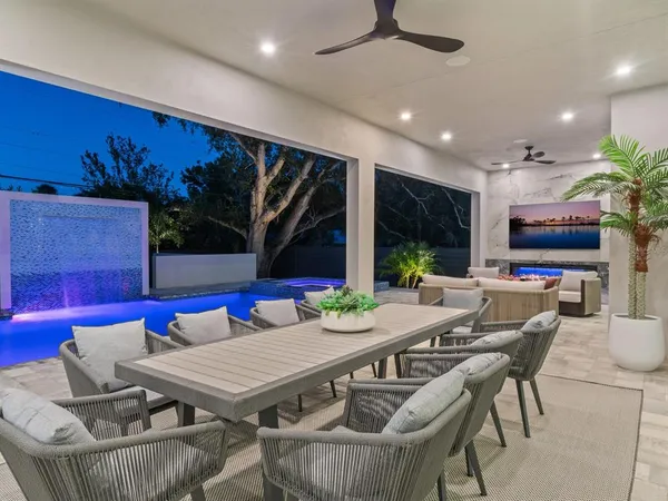 a view of a dining room with furniture window and outside view