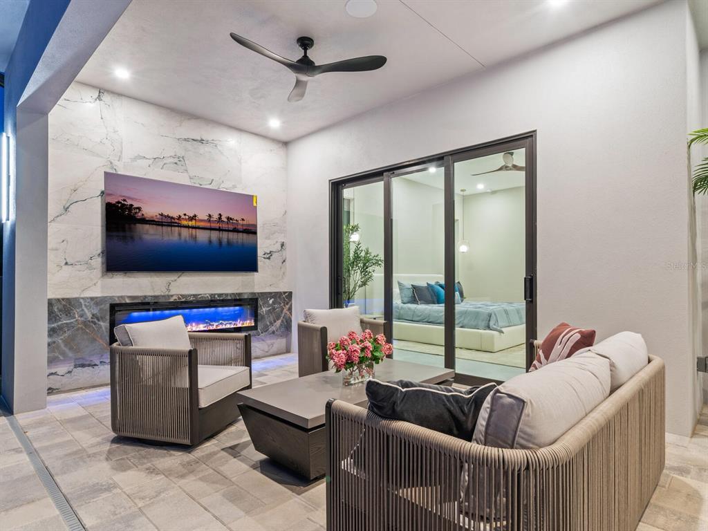 2467 Hyde Park Street Sarasota, FL 34239 - Photo 38 of 42 a living room with furniture and a flat screen tv