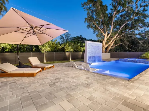 a view of swimming pool with outdoor seating