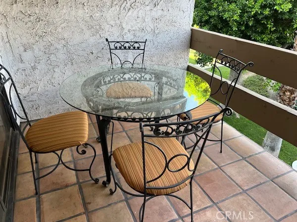 a view of a chairs and table in the terrace