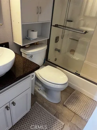 a bathroom with a toilet and a sink