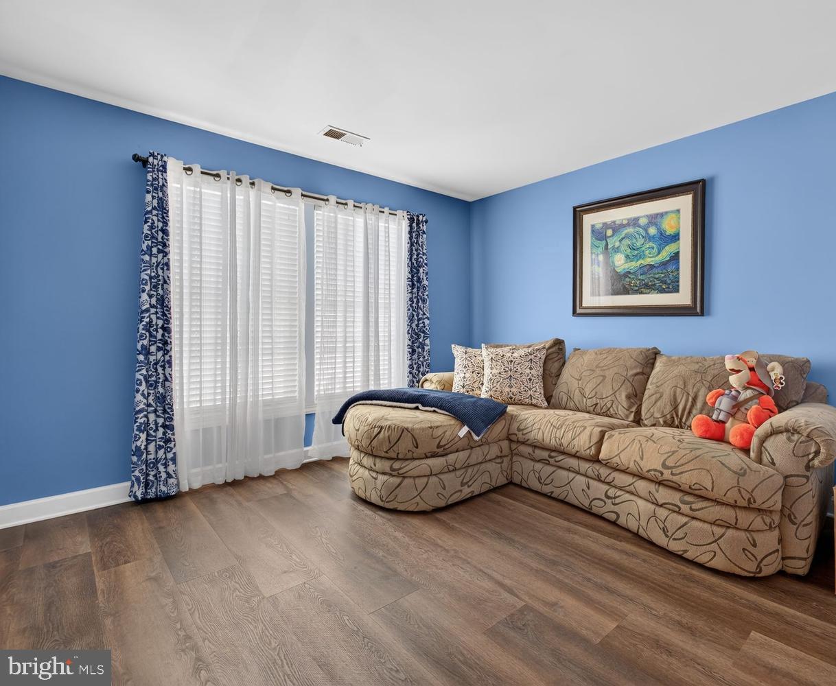 23106 Birch Mead Road Clarksburg, MD 20871 - Photo 21 of 60 a living room with couches and a large window