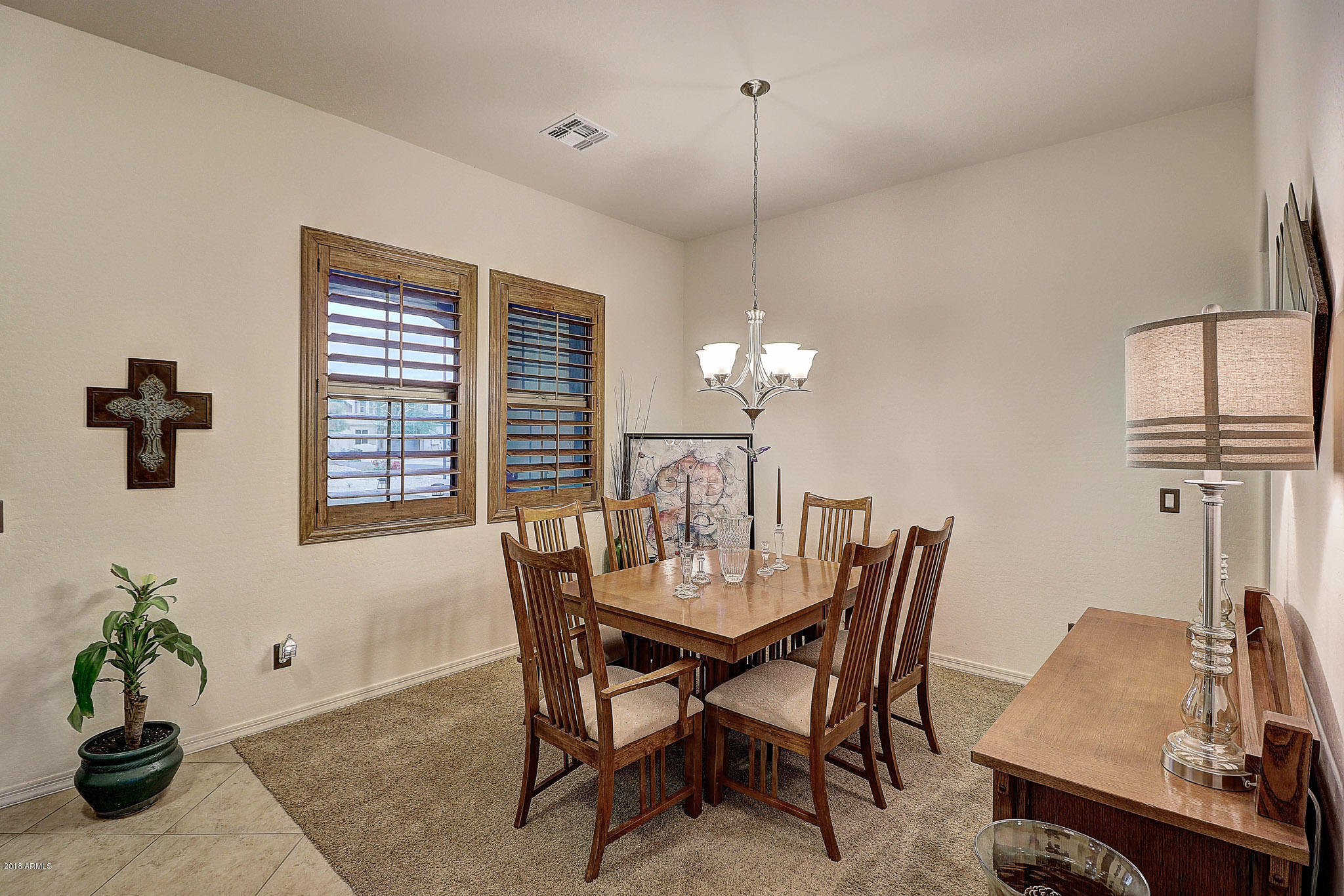 18271 West Desert Trumpet Road Goodyear, AZ 85338 - Photo 20 of 49 Dining Area with Plantation Shutters