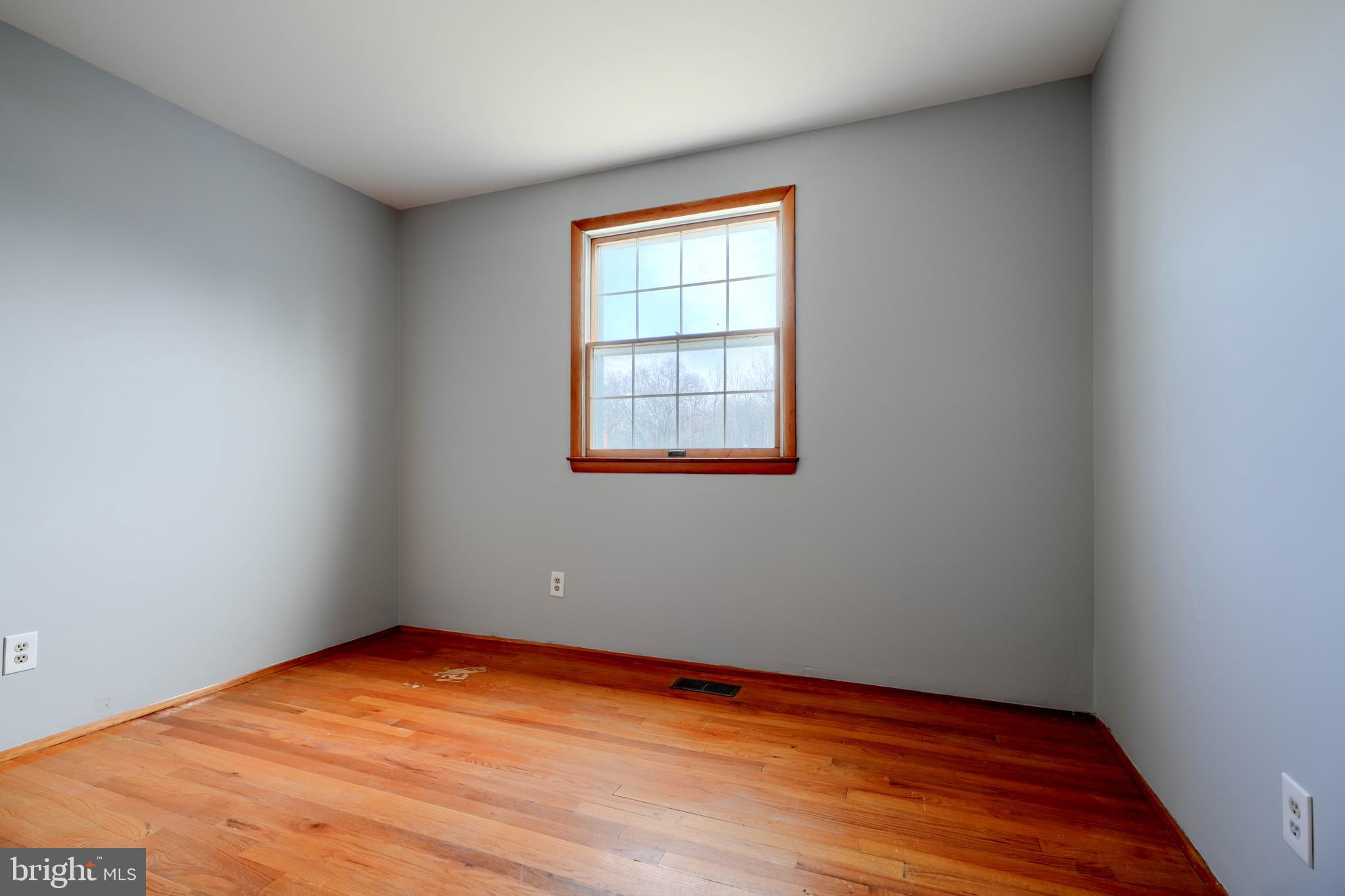 4425 Wynn Road Baltimore, MD 21236 - Photo 17 of 39 wooden floor in an empty room with a window