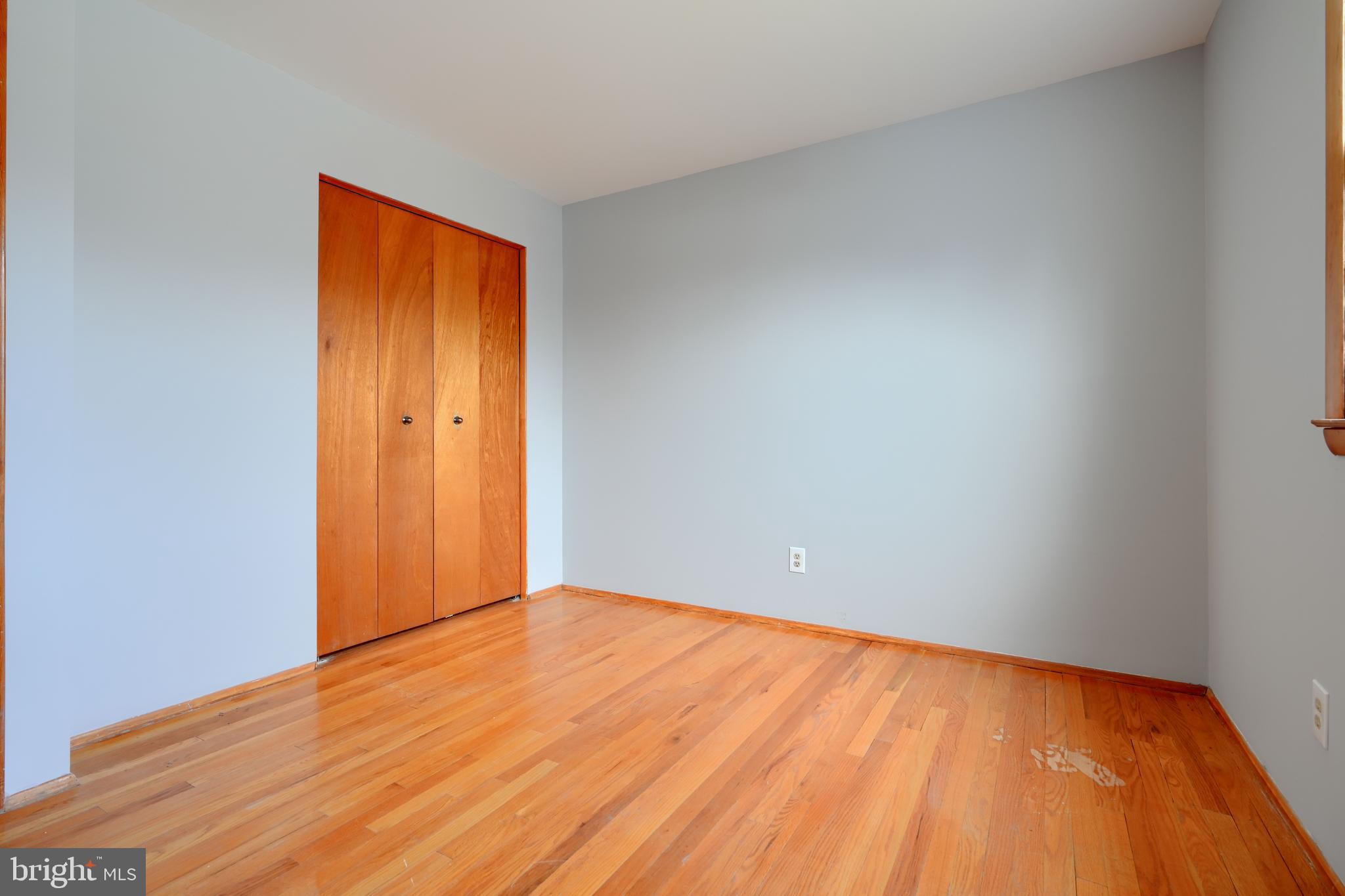 4425 Wynn Road Baltimore, MD 21236 - Photo 18 of 39 a view of an empty room with wooden floor and a window