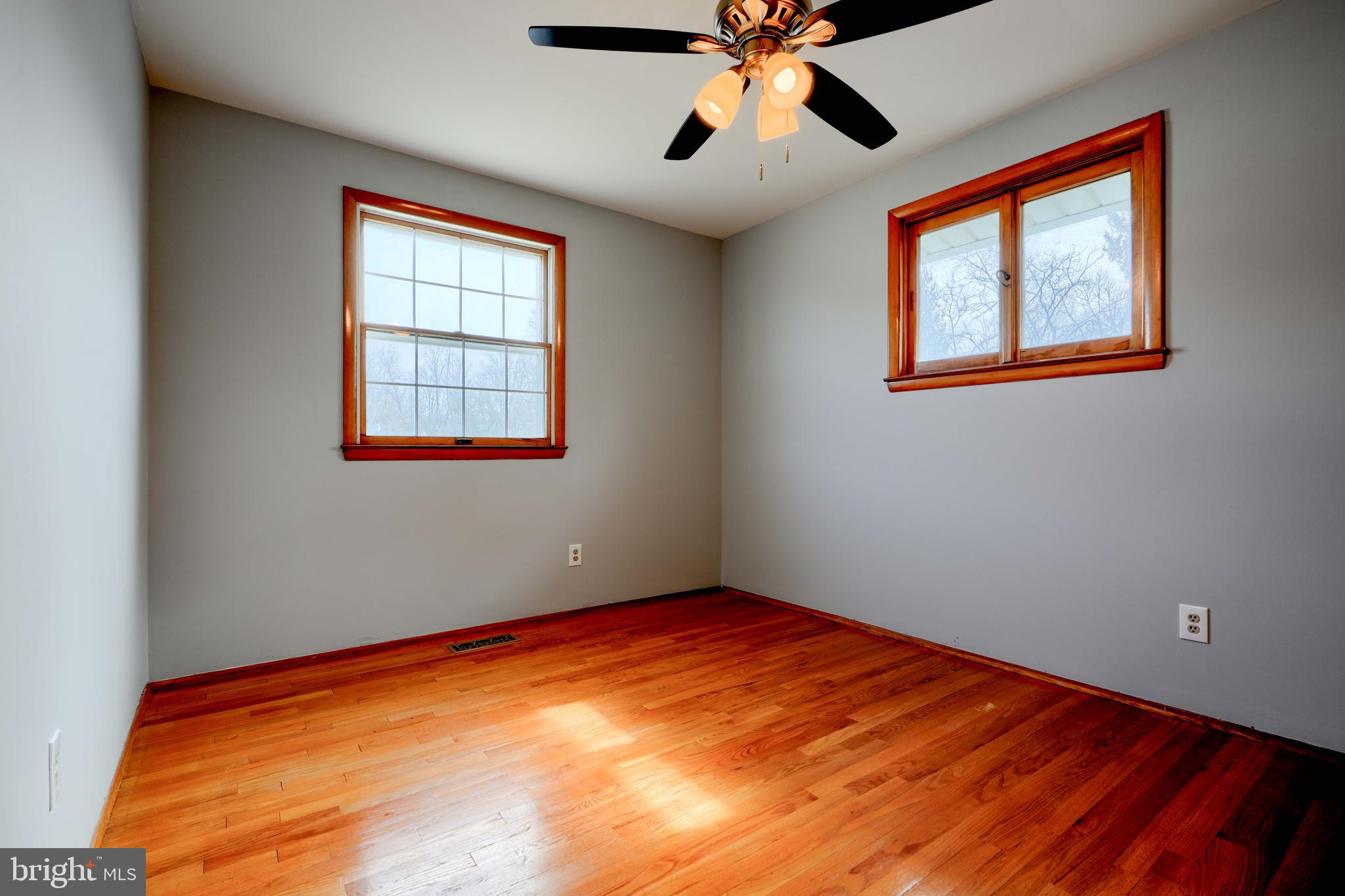 4425 Wynn Road Baltimore, MD 21236 - Photo 19 of 39 a view of empty room with wooden floor and fan
