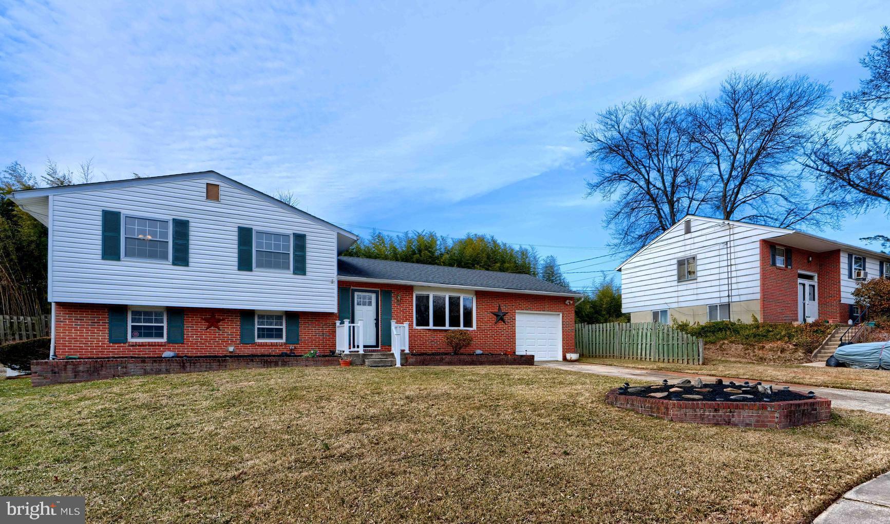 4425 Wynn Road Baltimore, MD 21236 - Photo 2 of 39 a front view of a house with a yard