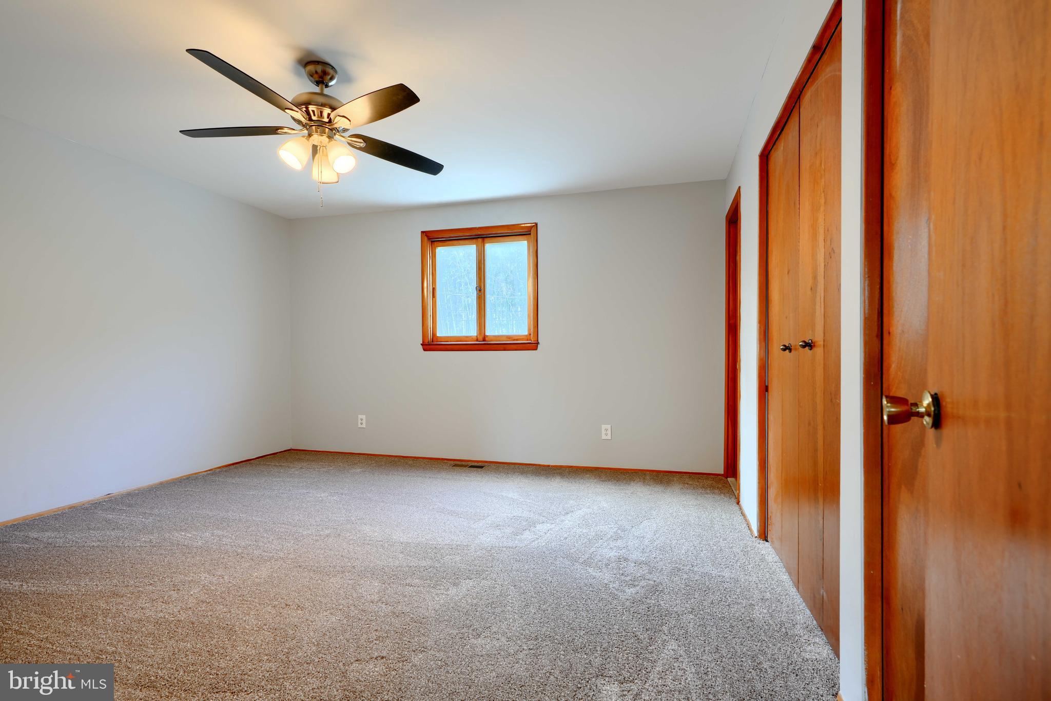4425 Wynn Road Baltimore, MD 21236 - Photo 24 of 39 an empty room that has a window and a fan