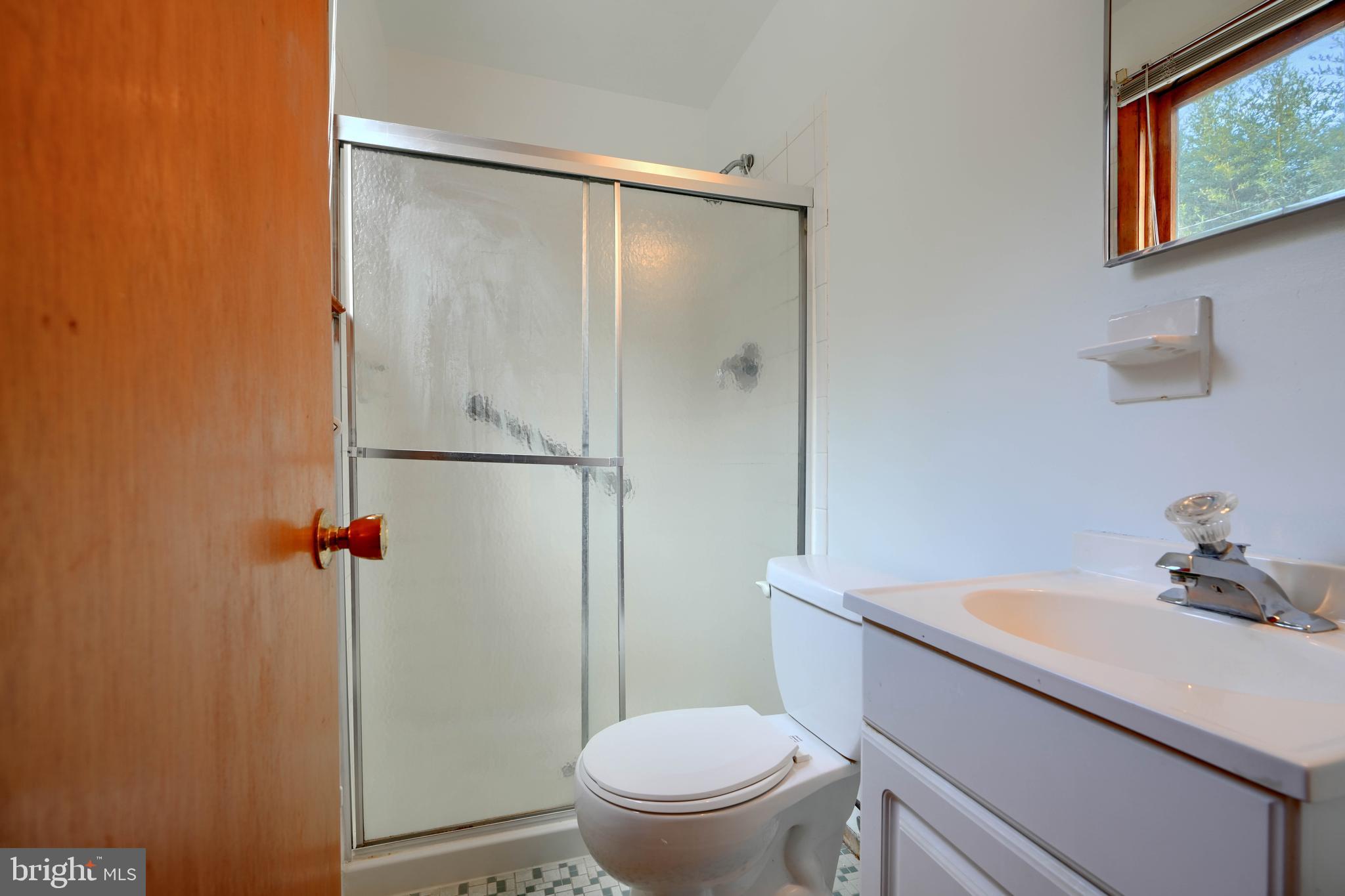 4425 Wynn Road Baltimore, MD 21236 - Photo 27 of 39 a bathroom with a sink a toilet and shower