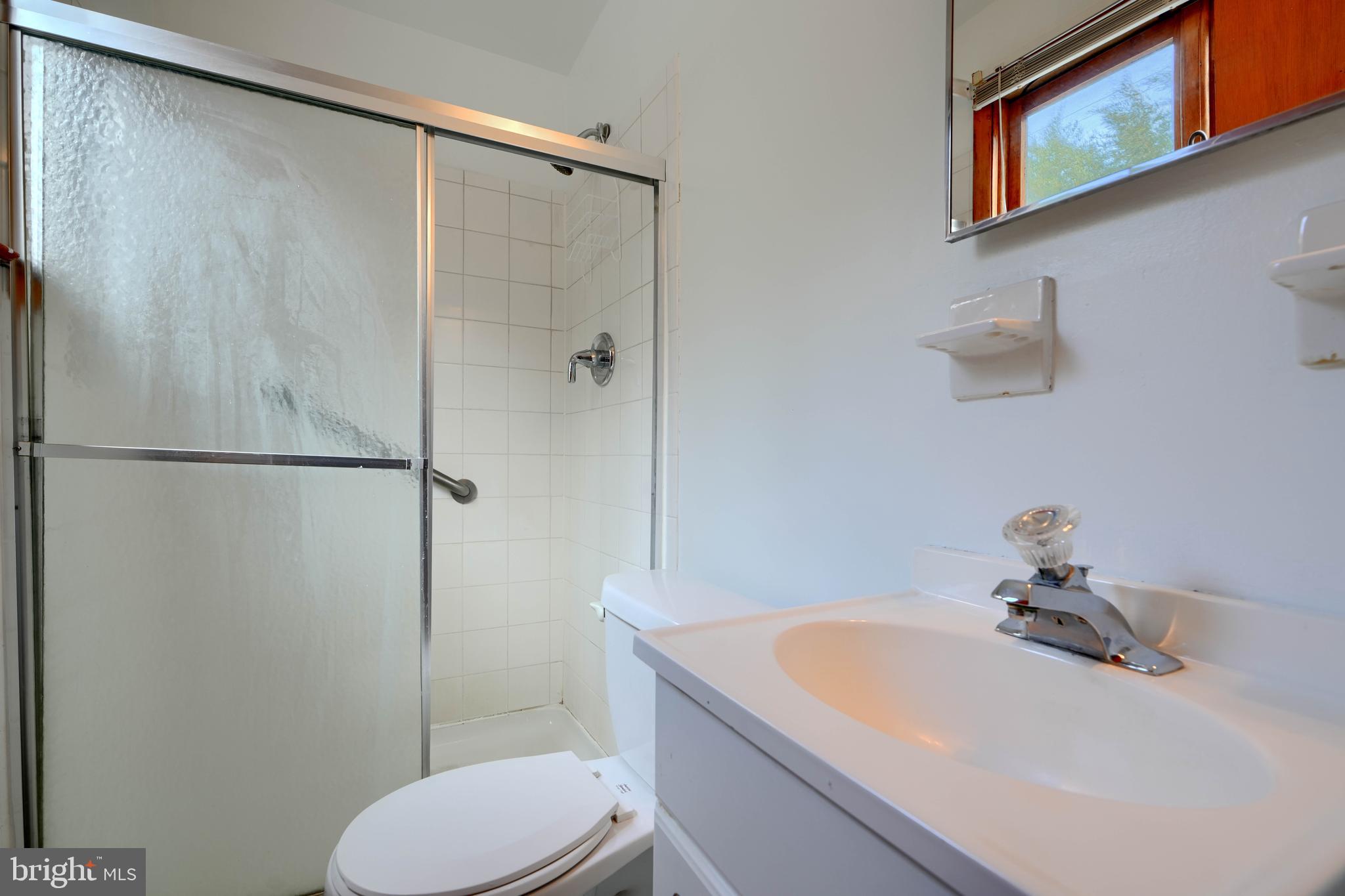 4425 Wynn Road Baltimore, MD 21236 - Photo 29 of 39 a bathroom with a sink toilet and shower