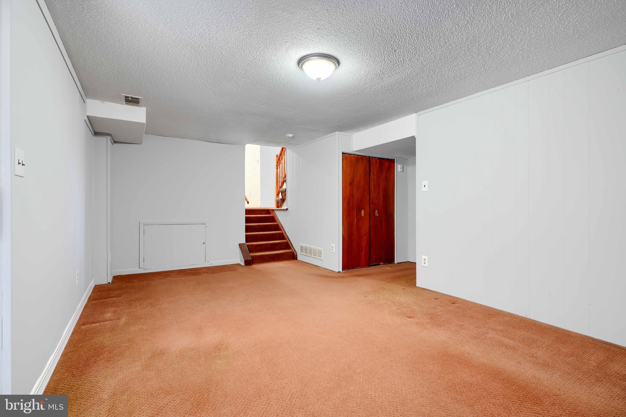 4425 Wynn Road Baltimore, MD 21236 - Photo 34 of 39 a view of an empty room with stairs and ventilation