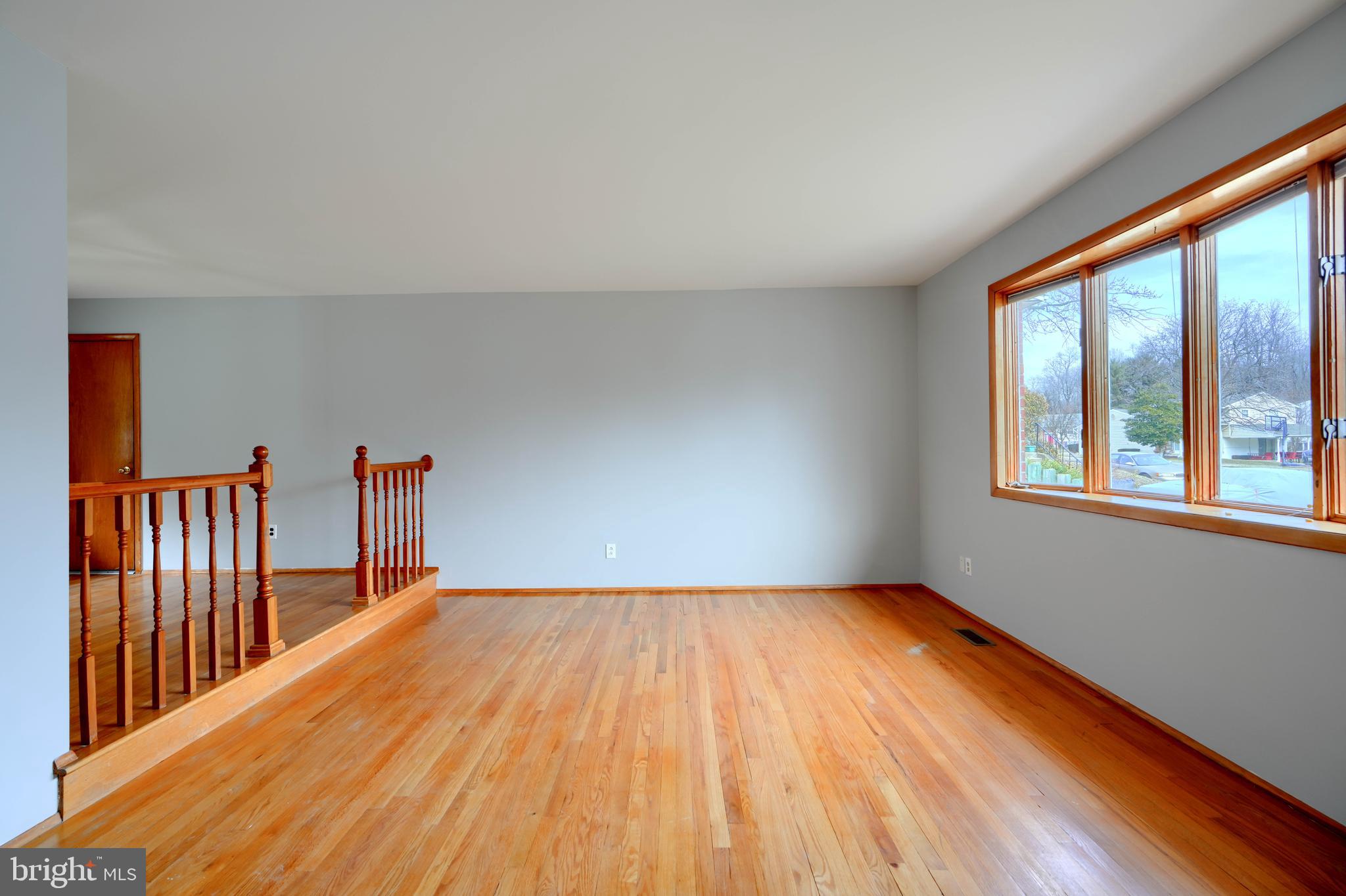 4425 Wynn Road Baltimore, MD 21236 - Photo 5 of 39 a view of a room with wooden floor and windows