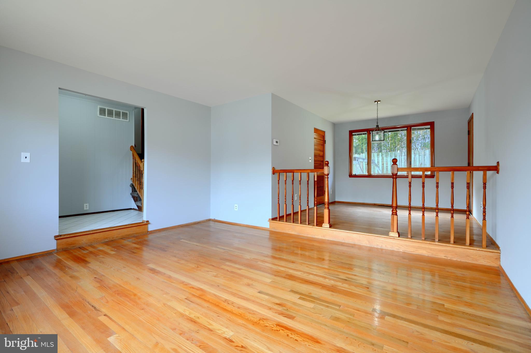 4425 Wynn Road Baltimore, MD 21236 - Photo 7 of 39 a view of empty room with wooden floor and fan