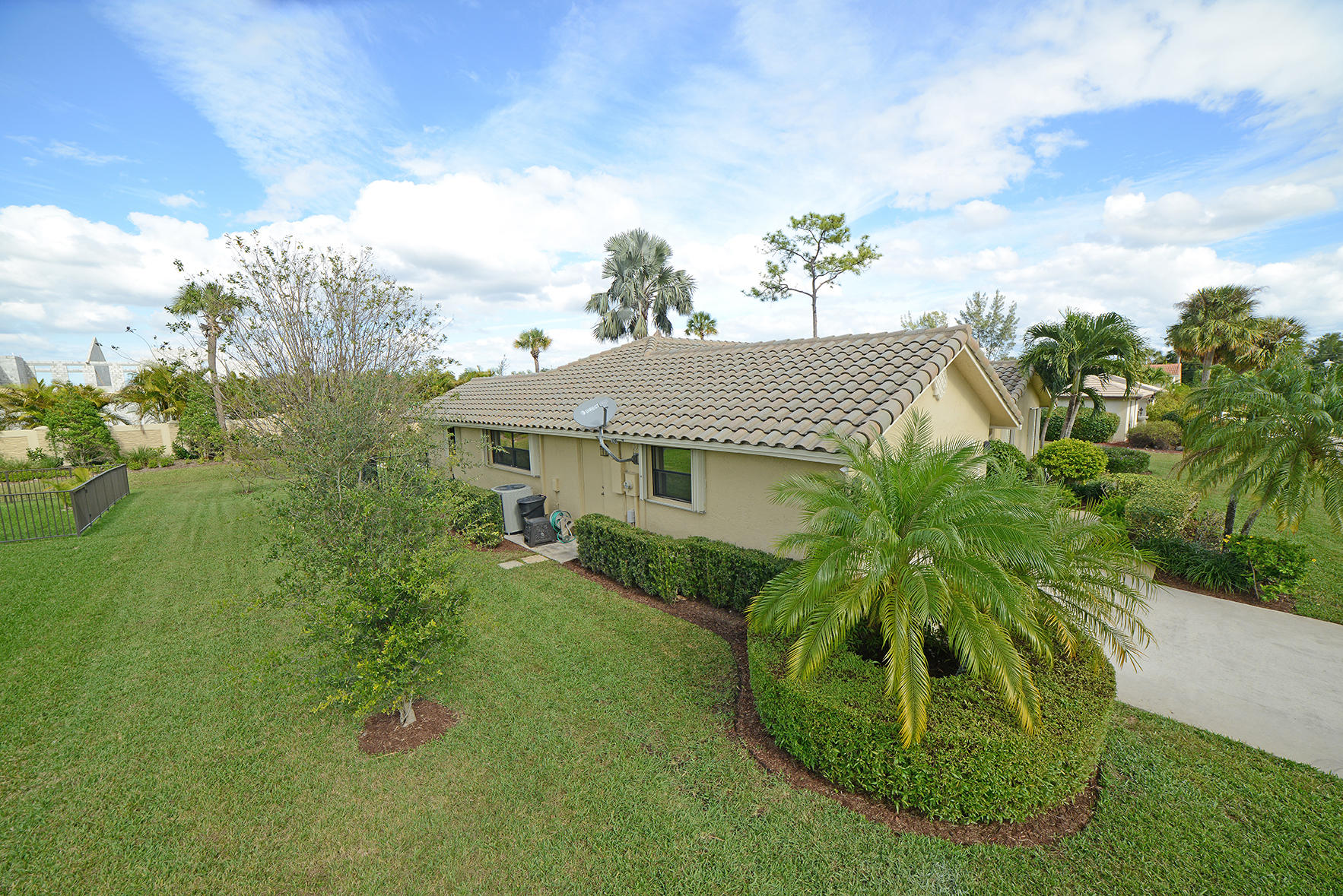 9053 Old Pine Road Boca Raton, FL 33428 - Photo 41 of 42 a front view of a house with a garden
