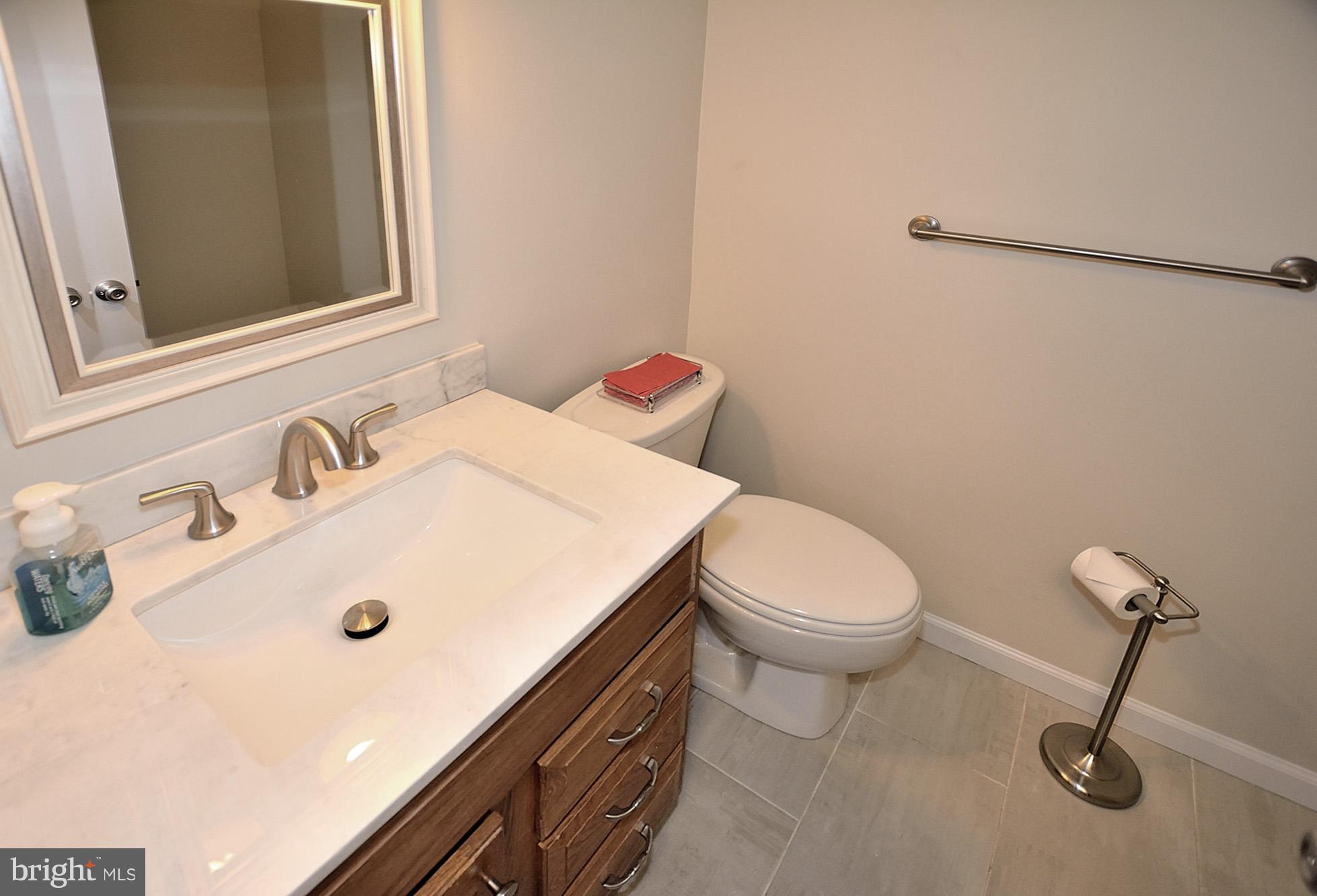 2101 Glencourse Lane Reston, VA 20191 - Photo 14 of 28 Main level powder room with new tile
