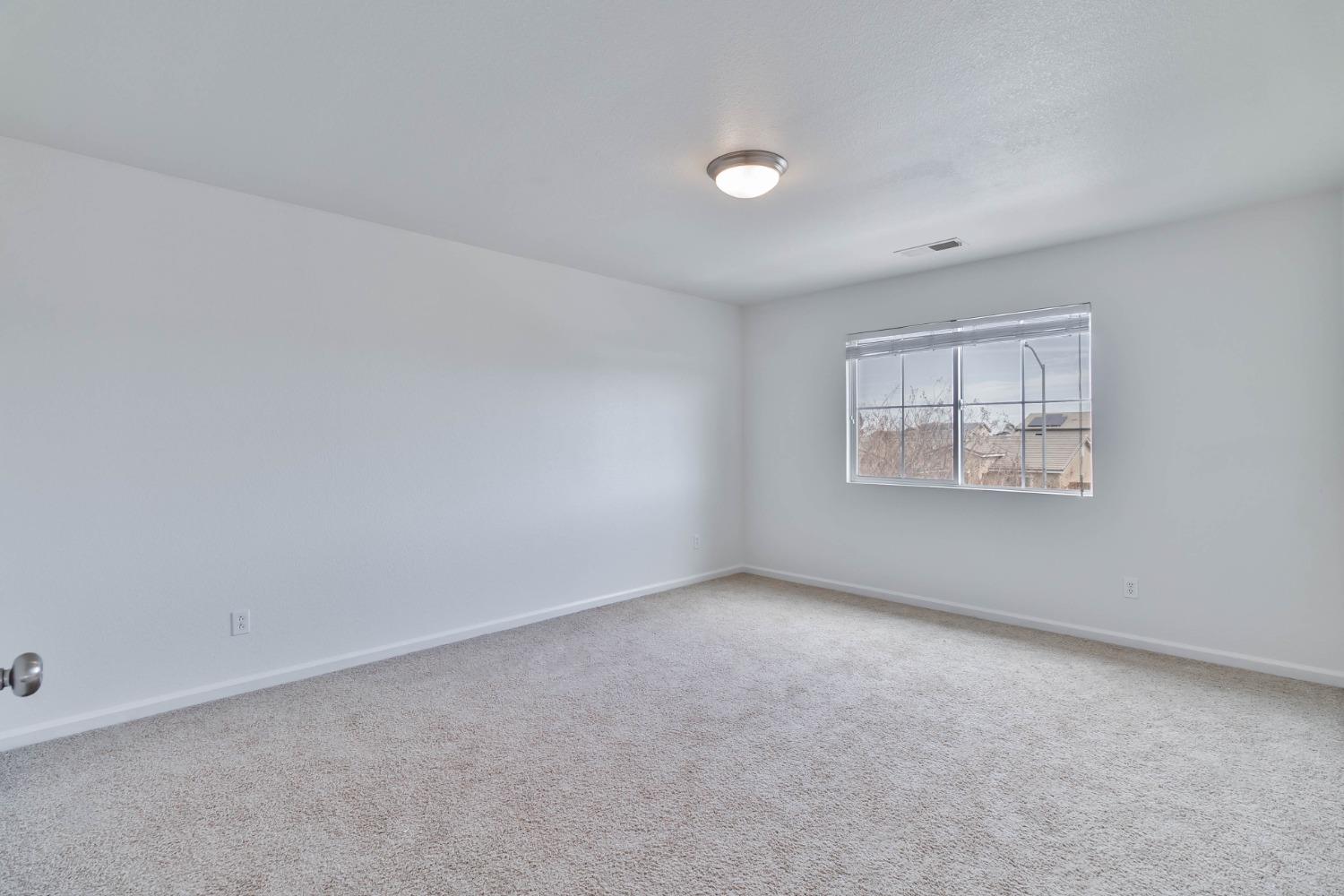 863 Chianti Circle Coalinga, CA 93210 - Photo 13 of 35 an empty room with windows