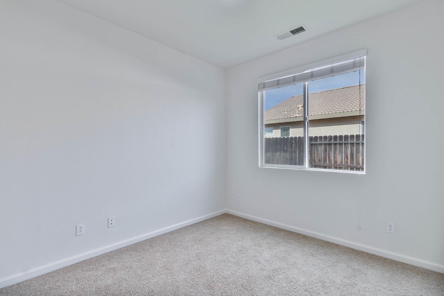 863 Chianti Circle Coalinga, CA 93210 - Photo 21 of 35 an empty room with a window