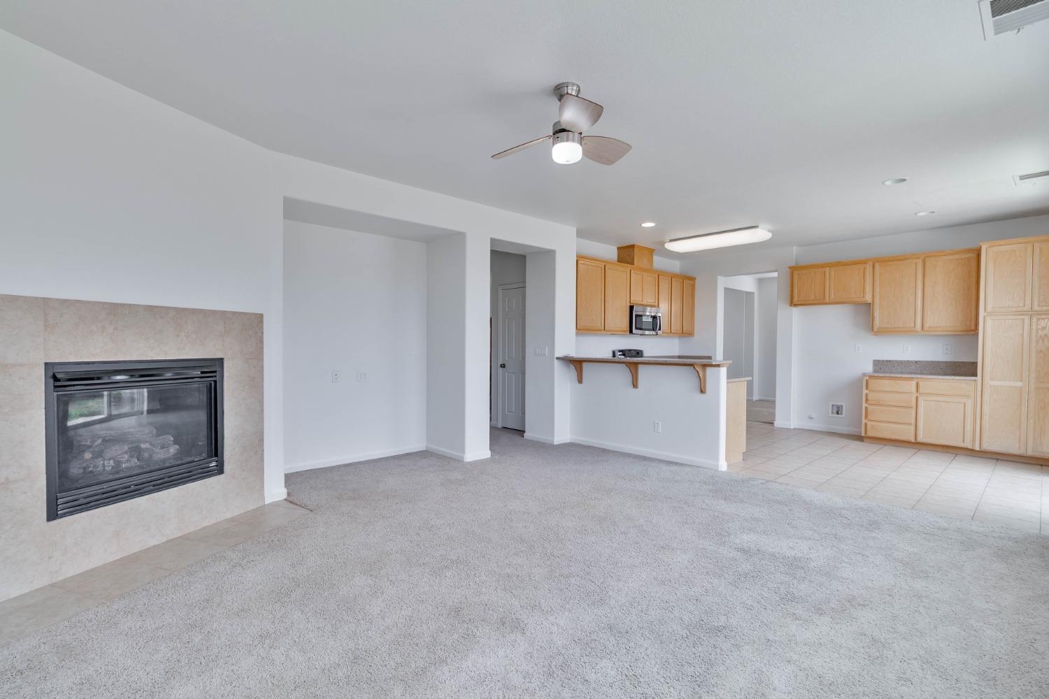 863 Chianti Circle Coalinga, CA 93210 - Photo 23 of 35 a view of a kitchen with a sink cabinets and a window