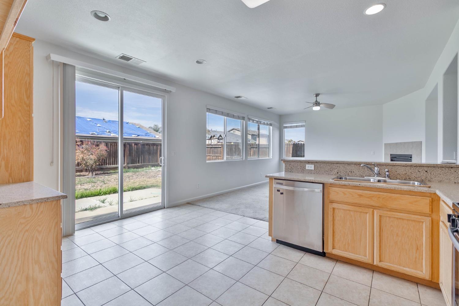 863 Chianti Circle Coalinga, CA 93210 - Photo 27 of 35 a open kitchen with a sink and cabinets