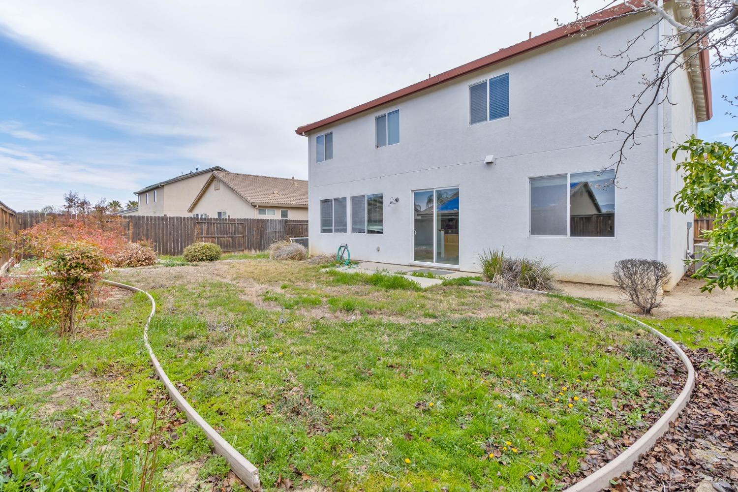 863 Chianti Circle Coalinga, CA 93210 - Photo 34 of 35 a house view with a garden space